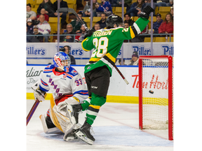 Connor Federkow of the London Knights celebrates after scoring the first goal of the game against Kitchener Rangers goalie Marco Constantini in the first period of their game at The Aud in Kitchener on Friday November 25, 2022. London won, 4-0. Derek Ruttan/The London Free Press/Postmedia Network