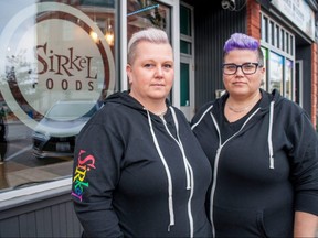 Mel Lang, left, and Kelly Ballantyne, a married couple who own Sirkel Foods in downtown Stratford, are grateful for the community support they’ve received after their restaurant was spray painted with homophobic graffiti this week. Still, they’ve decided to purchase security cameras, Ballantyne said. (Chris Montanini/Postmedia Network)