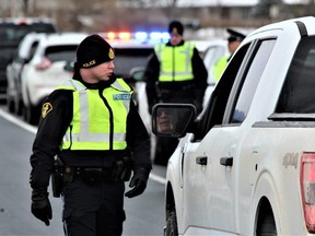 Middlesex OPP set up a RIDE checkpoint on the Highway 402 off-ramp at Colonel Talbot Road on Thursday, Nov. 17, 2022, to kick off the annual holiday campaign against impaired driving. The campaign, continuing until Jan. 2, comes at the end of a deadly year for impaired driving collisions in the area. (DALE CARRUTHERS/The London Free Press)