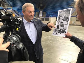 Former Soviet star goaltender Vladislav Tretiak, filmed by Ice-Breaker director/co-producer Robbie Hart in Moscow’s Luzhniki Palace of Sports, discusses a photo of the famous Paul Henderson goal in Game 8 of the 1972 Summit Series.