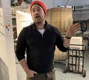 Avling Brewery founder Max Meighen explains the brewhouse setup, including the use of oak barrels for creative small-batch beers. (Barbara Taylor/The London Free Press)