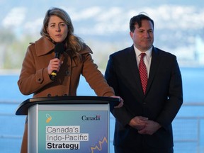 Minister of Foreign Affairs Melanie Joly, left, responds to questions as Minister of Public Safety Marco Mendocino listens during a news conference to announce Canada's Indo-Pacific strategy in Vancouver on Sunday. (Darryl Dyck/The Canadian Press)