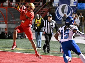 Laval University Rouge et Or Kevin Mital catches his third touchdown pass during RSEQ Dunsmore Cup university football action in Quebec City on Nov. 12. Mital has been named the Hec Crighton Award winner. (THE CANADIAN PRESS/Jacques Boissinot)