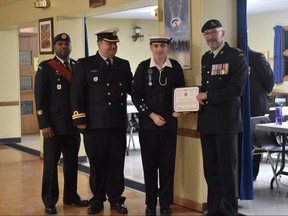 Ronnie Hannon, middle right, of the Woodstock Royal Canadian Sea Cadet Corps, is flanked by his father Sub Lt. Doug Hannon, middle left, as he receives a Certificate of Commendation for his work in getting Mental Health First Aid training to his cadet group. The 17-year-old, a petty officer 1st class, advocated for the training after a fellow cadet died by suicide in 2016. (Submitted photo)