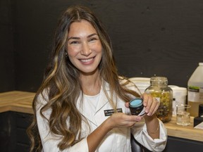 Maria Ramey shows some of the products she developed and produces for her business, Understory Botanicals Skincare in Mt. Brydges. Photograph taken on Wednesday, Oct. 19, 2022. (Derek Ruttan/The London Free Press)