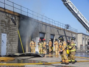 Smoke billows from a fire at a commercial plaza at 203 Exeter Rd. in London on Wednesday, Nov. 2, 2022. No one was injured in the blaze that caused an estimated $500,000 in damage, the London fire department says. Derek Ruttan/The London Free Press