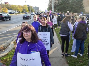 Hundreds of education workers and their supporters picket outside of the constituency office of London West MPP Peggy Sattler in London on Friday, Nov. 4, 2022. (Derek Ruttan/The London Free Press)
