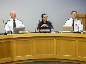 Left to right, London police deputy chiefs Stu Betts and Trish McIntyre sit with Chief Steve Williams during a police services board meeting in London on Monday November 7, 2022. (Derek Ruttan/The London Free Press)