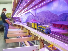 Alex Cabita operates the Lake Erie and International Railroad replica during the London Model Railroad Group's open house in London on Tuesday November 8, 2022.  (Derek Ruttan/The London Free Press)