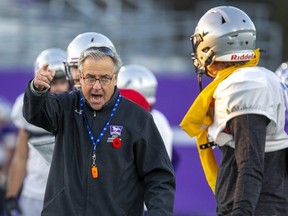 Western Mustangs head coach Greg Marshall offers instruction to James Piper during a team practice in London on Wednesday Nov. 9, 2022. (Derek Ruttan/The London Free Press)