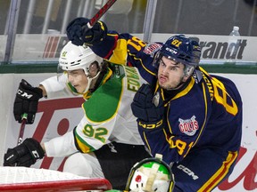 Barrie Colts forward Chris Grisolla reacts to being struck in the face with Jackson Edward's stick during their game against the London Knights at Budweiser Gardens in London on Friday November 11, 2022. 
Edward received a two-minute penalty for high sticking. Derek Ruttan/The London Free Press/Postmedia Network