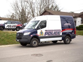 Forensic officers from Waterloo Regional police assist Woodstock police in the investigation of a suspicious death at an apartment complex at 161 Fyfe Ave. in Woodstock on Tuesday, Nov. 29, 2022. (Derek Ruttan/The London Free Press)