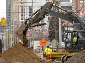 Construction crews replace sewer lines and watermains on King Street just east of Adelaide Street on Tuesday March 22, 2022. 
(Mike Hensen/The London Free Press)