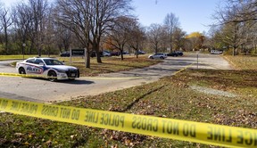 London police guard the scene of a homicide at the Grosvenor Street entrance to Gibbons Park in London on Monday, Nov. 7, 2022. Daniel Joseph Fawcett, 52, of London, was identified Monday as the victim by police. (Mike Hensen/The London Free Press)