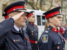 London police Chief Steve Williams salutes as O Canada plays during Remembrance Day ceremonies at the cenotaph in Victoria Park Friday,  Nov. 11.  (Mike Hensen/The London Free Press)