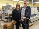 Sandra and Brian Hoekstra of Allegra Marketing Print Mail – with their pooch Archie – are seeing the 101-year-old London business grow again after the pandemic hit, helped by a broadened array of products and services.  (Mike Hensen/The London Free Press)