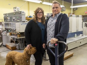 Sandra and Brian Hoekstra of Allegra Marketing Print Mail – with their pooch Archie – are seeing the 101-year-old London business grow again after the pandemic hit, helped by a broadened array of products and services.  (Mike Hensen/The London Free Press)