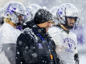 Western Mustangs head coach Greg Marshall squints amid a snow squall during practice on Thursday, Nov. 17, 2022, at Alumni Stadium in London. (Mike Hensen/The London Free Press)
