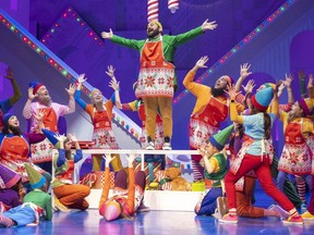 Izad Etemadi, centre, plays the lead character Buddy in the Grand Theatre's production of Elf: The Musical. (Mike Hensen/The London Free Press)