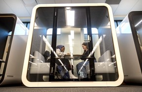 King's University College students Tasniem Elniwairi and Fiona Bousada use a sound-proof pod in the new Elizabeth Russell Achievement Center in its G. Emmett Cardinal Carter Library. (Mike Hensen/The London Free Press)