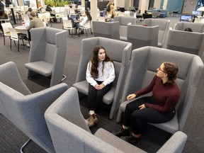 Kings University College students Alexis Carreiro and Aime Paradis chat in the large new chairs that are part of the renovations at its G. Emmett Cardinal Carter Library.
The renovations were paid for by a $1-million donation from the estate of former chief librarian Elizabeth Russell.
(Mike Hensen/The London Free Press)