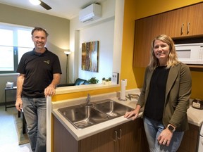 Graham Cubitt and Natasha Thuemler of Indwell show a model suite at the charity's new affordable housing project called Embassy Commons on Dundas Street in London on Thursday Nov. 24, 2022. (Mike Hensen/The London Free Press)