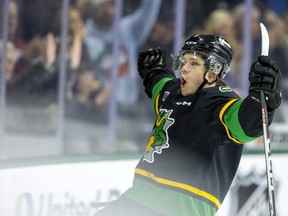 Easton Cowan of the London Knights celebrates after scoring against the Guelph Storm to tie the game at 2-2 late in the first period on Tuesday November 29, 2022. The Knights, wearing retro jerseys, won, 6-2. Mike Hensen/The London Free Press/Postmedia Network