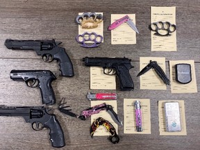 Seven people face charges after St. Thomas police seized more than $12,000 in drugs and several weapons, including air pistols, brass knuckles and flick knives, from a Talbot Street apartment on Thursday. (St. Thomas police photo)
