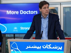 B.C. Premier David Eby speaks during an announcement about the expansion of a program that assists internationally educated doctors in obtaining a licence to practise in the province on Sunday, Nov. 27, 2022.