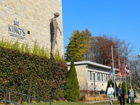 King's University College has lowered its flags to half-mast in the wake of a two-vehicle crash on Monday that killed two international students from China. (Calvi Leon/The London Free Press)