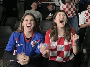 Milana Hestera, left, and Eva Brajak cheer as Croatia scores its final goal of its FIFA World Cup match against Canada on Sunday Nov. 27, 2022. Croatia prevailed over Team Canada 4-1. (Jennifer Bieman/The London Free Press)