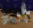 Three London residents face charges after police seized a handgun, ammunition, drugs, cash and other items from a vehicle and a home on Lemieux Walk on Wednesday, police said. (London police photo)