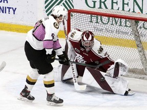 Kingston Frontenacs Maddox Callens is stopped on a breakaway by Peterborough Petes goalie Michael Simpson during Ontario Hockey League action at the Leon's Centre in Kingston on Nov. 19, 2021.