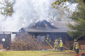 No one was hurt, but fire destroyed this home, a garage and two vehicles at 4646 Calvert Dr. in Glencoe Tuesday, Dec. 13. Damage was estimated at $800,000, Adelaide Metcalfe fire officials say.  (Derek Ruttan/The London Free Press)