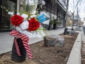 A floral memorial for London Knights player Abakar Kazbekov is seen in front of the Azure Condominiums at the corner of Talbot Street and Dufferin Avenue. (Derek Ruttan/The London Free Press)