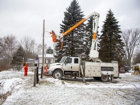 A Hydro One crew make repairs in Port Burwell on Monday, Dec. 26, 2022. Residents and businesses had been without power since Friday when a storm hit.  Derek Ruttan/The London Free Press