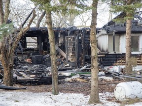 Three adults and four children have have been displaced after fire destroyed their home on Rebecca Road near Thorndale on Wednesday December 28, 2022. (Derek Ruttan/The London Free Press)