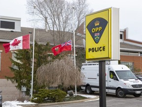 Flags are lowered to half-staff at the OPP detachment in Cayuga, Ont. on Wednesday, Dec. 28, 2022 after OPP Const. Grzegorz (Greg) Pierzchala, who worked out of the detachment, was shot and killed  just west of Hagersville Tuesday. Letter-writer James D. Lush is angry the male suspect was released on bail six months ago. (Derek Ruttan/The London Free Press)
