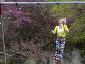 Simone Maguire enjoys a swing in London's Springbank Park on Wednesday, May 11, 2022. "They give me a really free feeling, almost like flying, and you feel it in the pit of your stomach," she said. (Mike Hensen/The London Free Press)