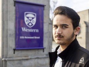 Fayaz Alamyar, 19, a refugee from Afghanistan who is studying computer science at Western University, is raising funds to bring his family to Canada. (Mike Hensen/The London Free Press)