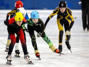 Ethan Pollock of the London Speed Skating Club leads in the early laps of a 1500m final at a provincewide mid-season meet at the Western Fair Sports Centre in London. Pollock ended up third. Photograph taken on Sunday December 11, 2022. 
Mike Hensen/The London Free Press