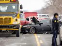 Three people were hurt in a three-vehicle collision on Elginfield Road, north of London, on Tuesday. A school bus carrying two students was involved. One student and a passenger in each of the other two vehicles were injured. (Mike Hensen/The London Free Press)