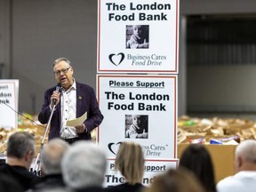 Wayne Dunn of the Business Cares Food Drive addresses supporters as the fundraising effort wrapped up its 23rd annual edition in London on Wednesday Dec. 21, 2022. (Mike Hensen/The London Free Press)