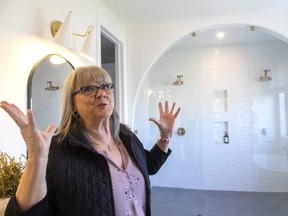 Mary Van Den Berge is overwhelmed by the size of the ensuite at the Talbotville home she won Wednesday in London hospitals' Dream Lottery. (Mike Hensen/The London Free Press)