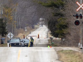 OPP officers were at Amiens Road near Komoka, west of London, Thursday, Dec. 22, after a single-vehicle rollover killed two people and sent three others – two with life-threatening injuries – to hospital. (Mike Hensen/The London Free Press)