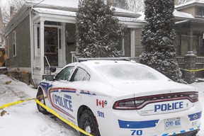London police guard the scene of a homicide at 727 Queens Ave., east of Adelaide Street, in London on Friday, Dec. 23, 2022. Mike Hensen/The London Free Press