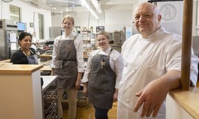Chef Rob Howland, right, owner of Baker’s Table and Pastry Co., talks about the rebranded food incubator at 630 Dundas St. with Carolina Matheus of QBites, left, and Baker’s Table staff Erika Van Geest and Kaitlyn Dowswell on Friday, Dec. 30, 2022. (Mike Hensen/The London Free Press)