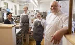 Chef Rob Howland, right, owner of Baker's Table and Pastry Co., talks about the rebranded food incubator at 630 Dundas St. with Carolina Matheus of QBites, left, and Baker's Table staff Erika Van Geest and Kaitlyn Dowswell on Friday, Dec.  30, 2022. (Mike Hensen/The London Free Press)