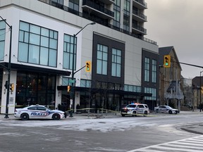 London police blocked off the intersection of Talbot Street and Dufferin Avenue after a person was found dead outside a luxury condo building on Dec. 17, 2022. (MEGAN STACEY/The London Free Press)