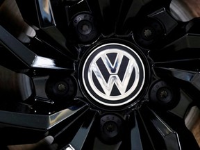 The logo of German carmaker Volkswagen is seen on a rim cap in a showroom of a Volkswagen car dealer in Brussels, Belgium July 9, 2020. (REUTERS/Francois Lenoir/File Photo)